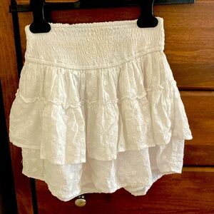 Flouncy white skirt with built-in shorts.
